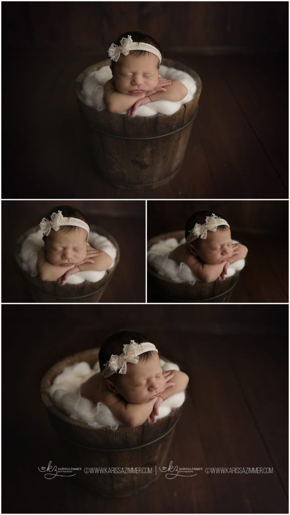Newborn baby girl photographed in bucket