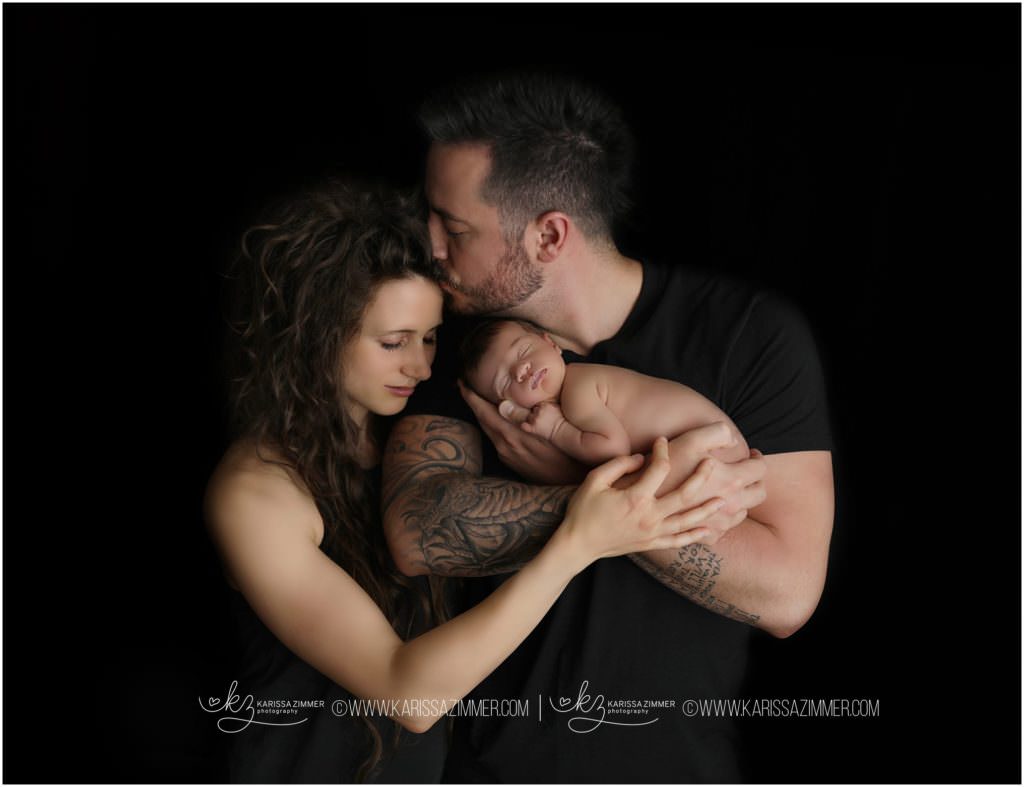 Parents holding newborn baby in Mechanicsburg PA with Karissa Zimmer Photography