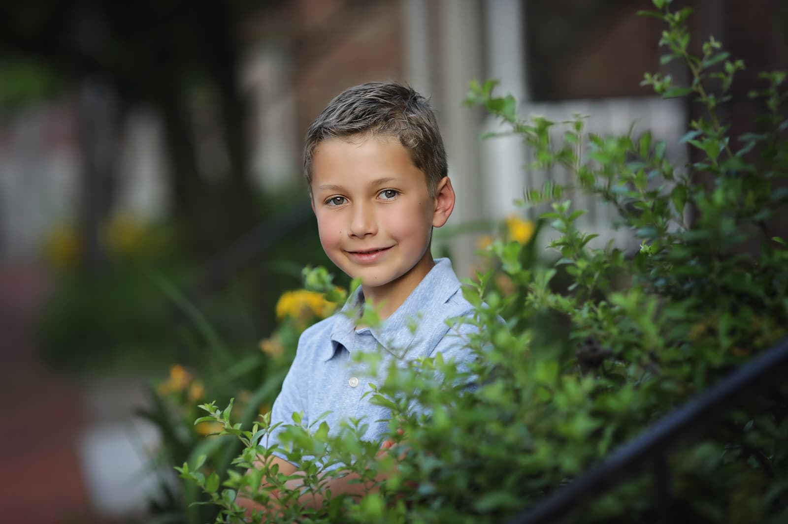 young boy poses during photo session with mechancisburg baby & child photographer