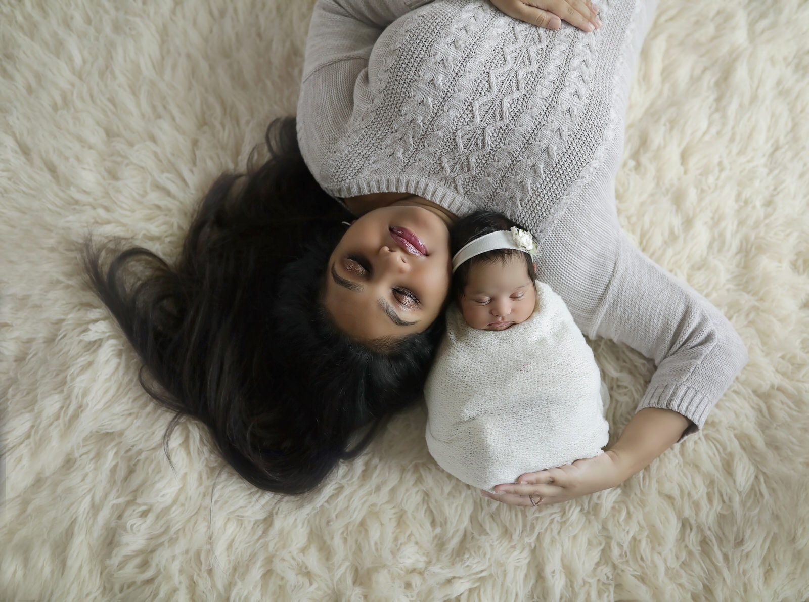 harrisburg newborn photographer captures mom with newborn daughter on white background