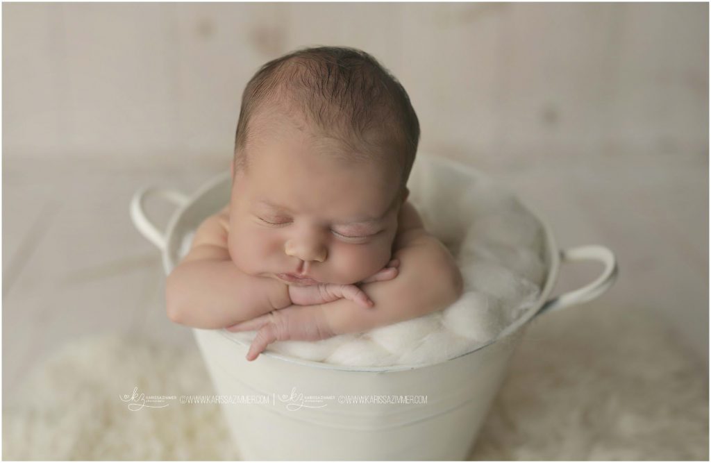 baby boy posed in white bucket by karissa zimmer photography