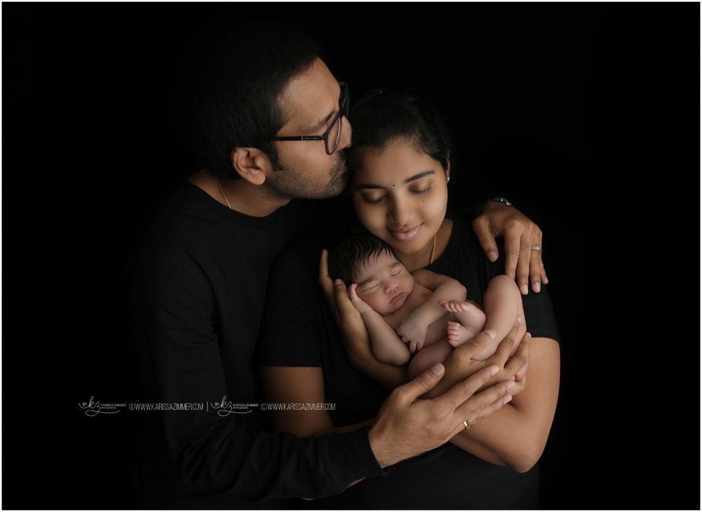 new mother and father holding newborn photographed in camp hill pa