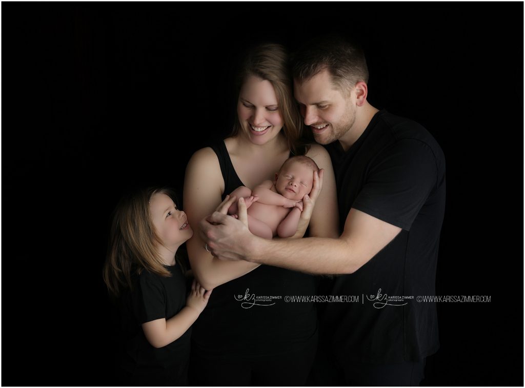 newborn baby boy and big sister photographed with parents