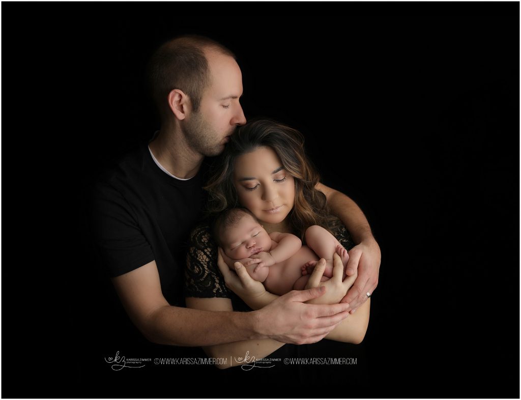 New parents photographed with their newborn baby girl near camp hill pa
