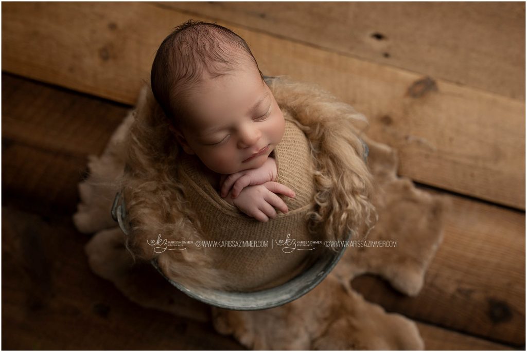 karissa zimmer photography captures images of posed newborn baby