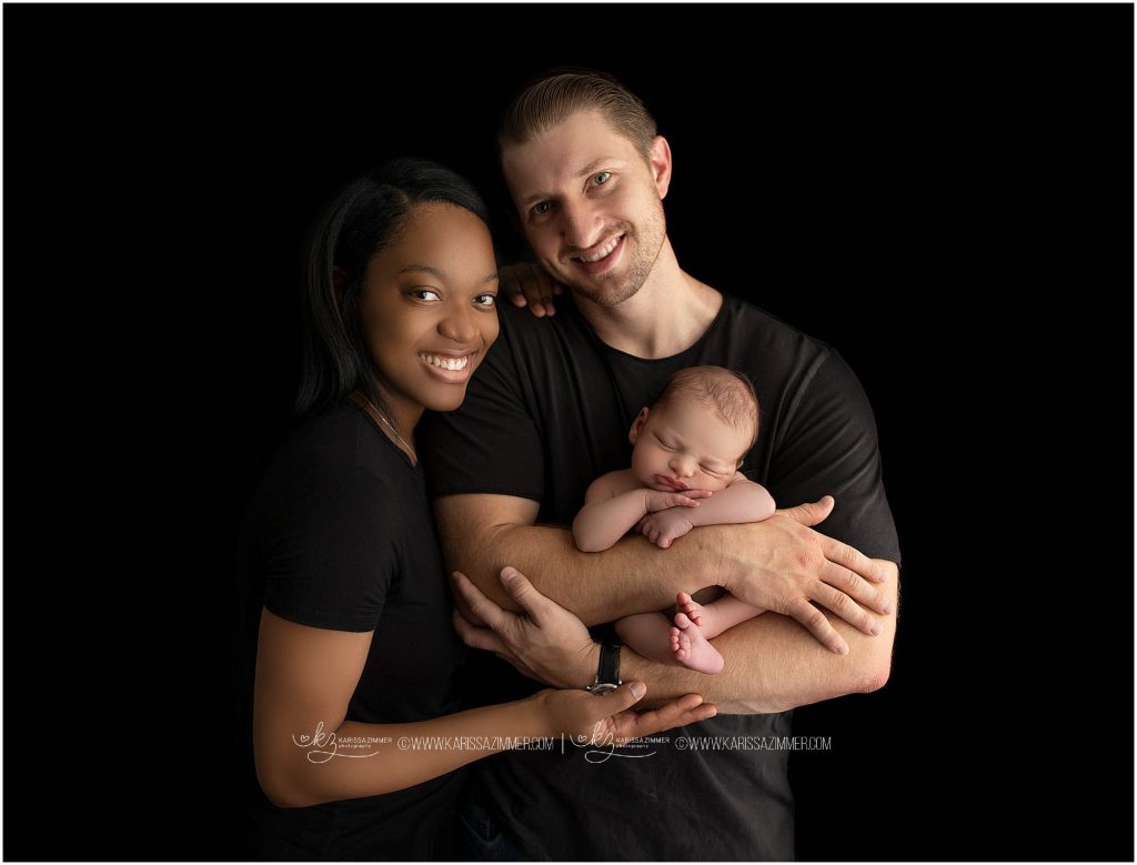 newborn photographer karissa zimmer photography captures image of newborn boy with parents