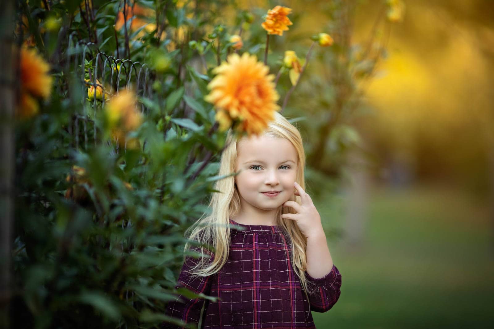 little girl photographed in flowers during child photography session in harrisburg pa