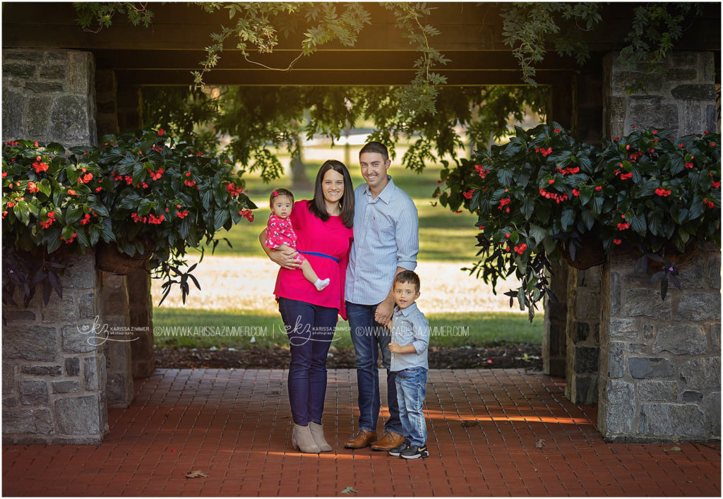 family of 4 is photographed together during their camp hill family session