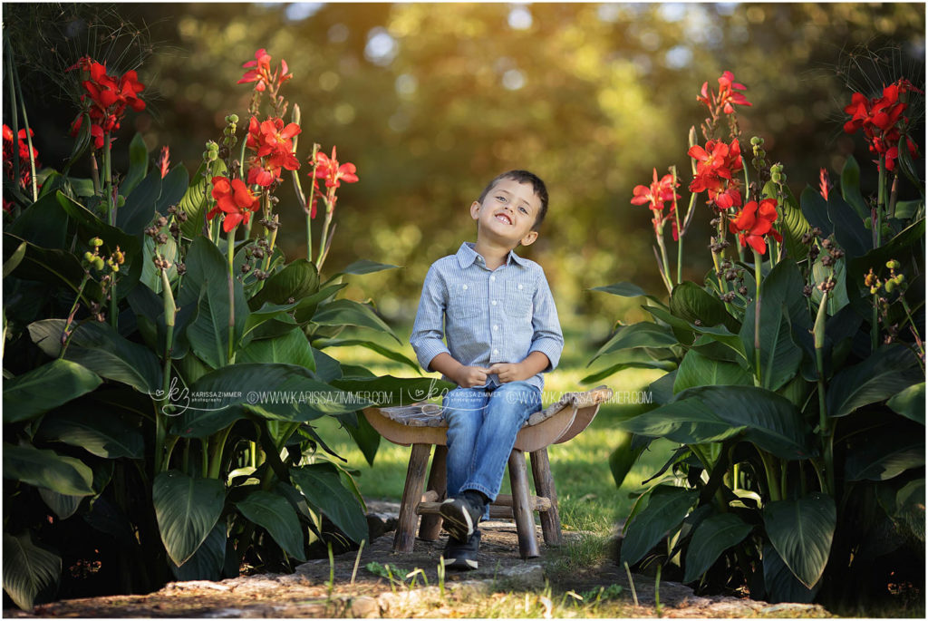 little boy smiles happily during his camp hill family photography session