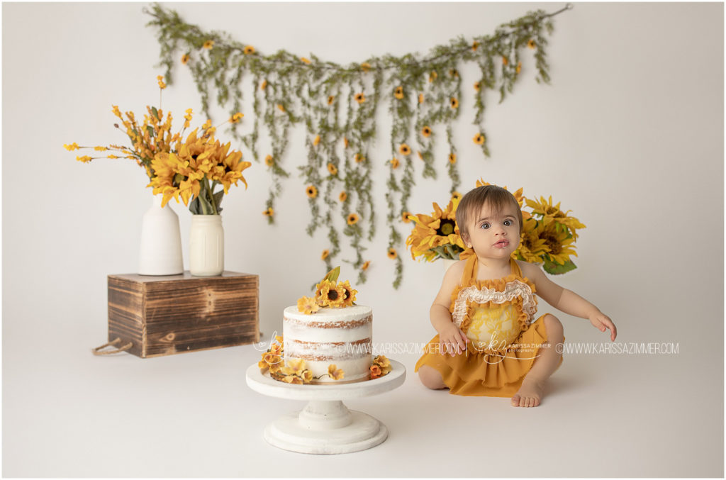 Sunflower first birthday cake smash photography session