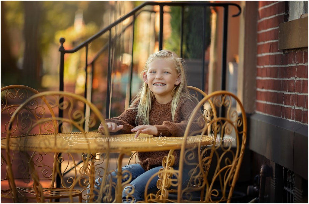 Young girl smiles while at her Fall Family Portrait session near Harrisburg PA
