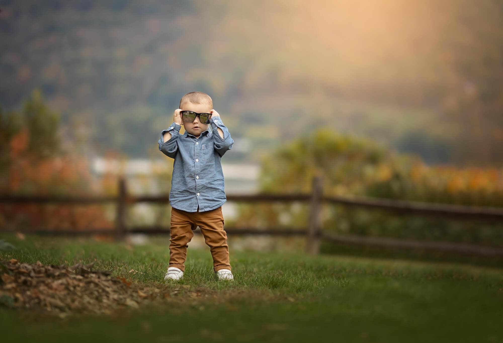 Childhood portrait photographer captures image of little boy wearing large sunglasses near Camp Hill PA