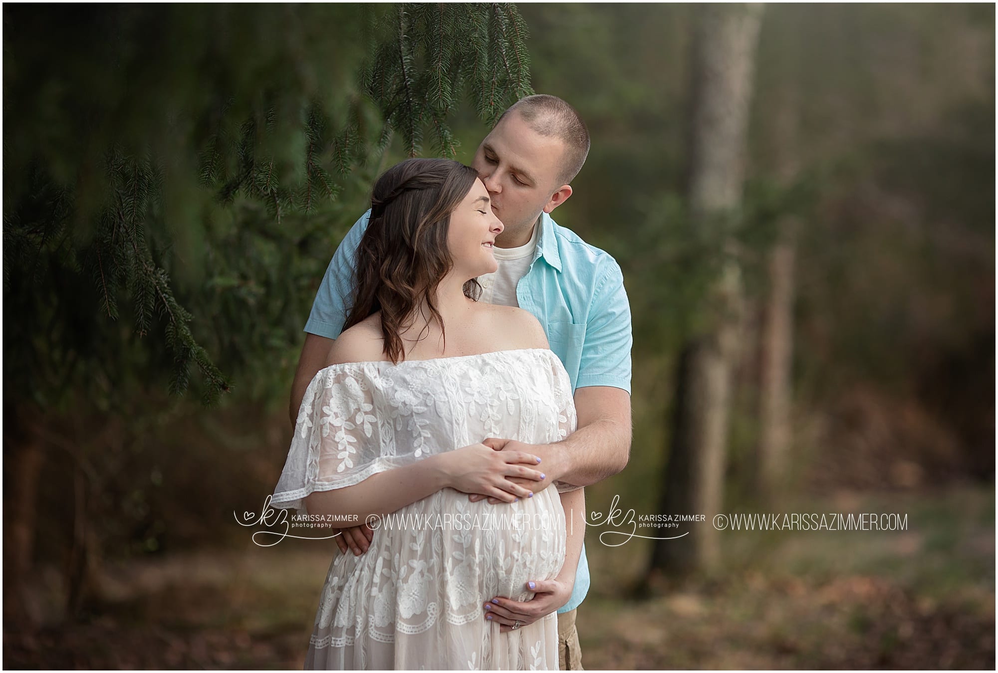 couple embraces during their outdoor maternity photoshoot with camp hill pa photographer