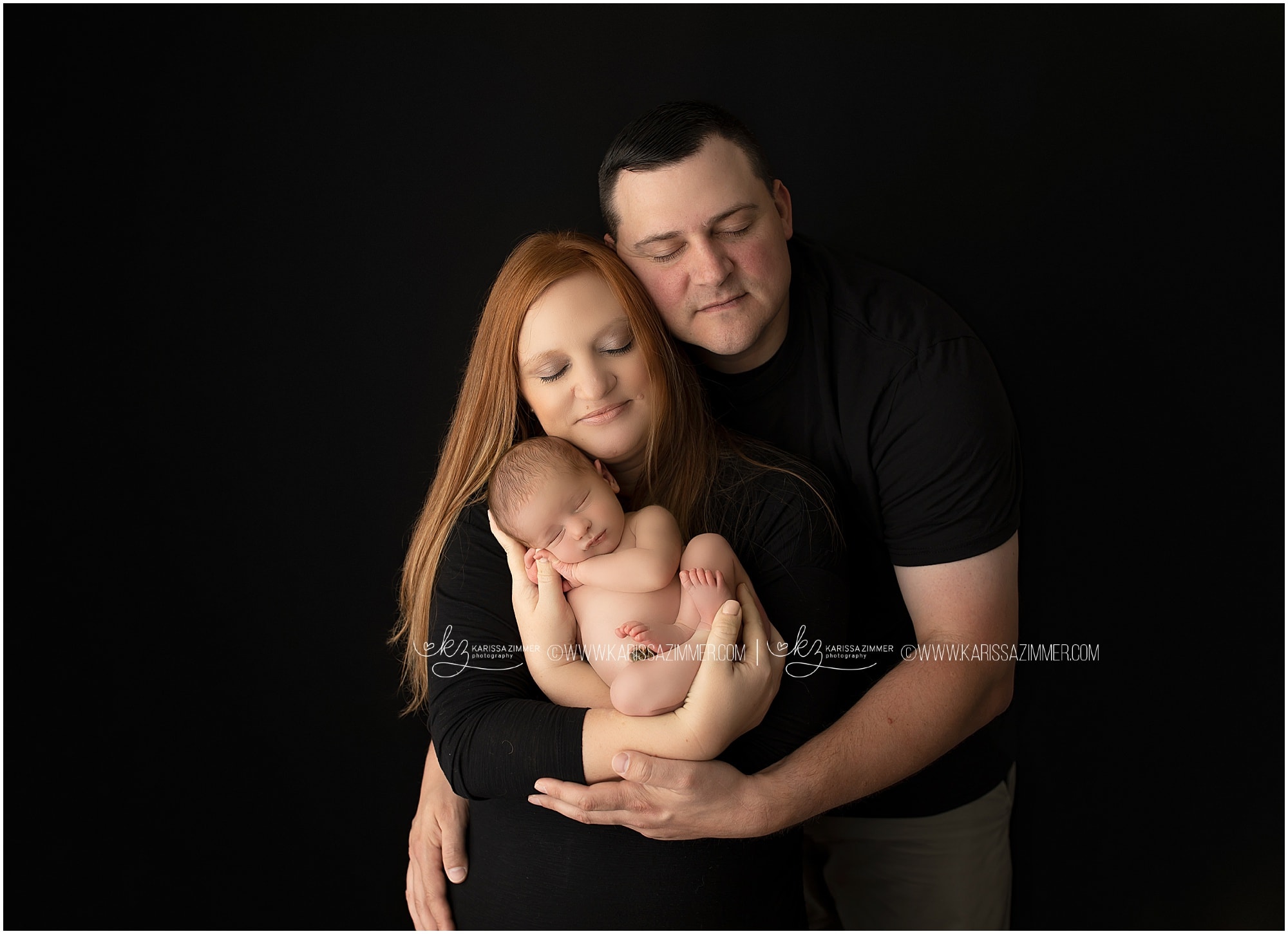 New parents pose with their newborn baby during photoshoot with Karissa Zimmer Photography