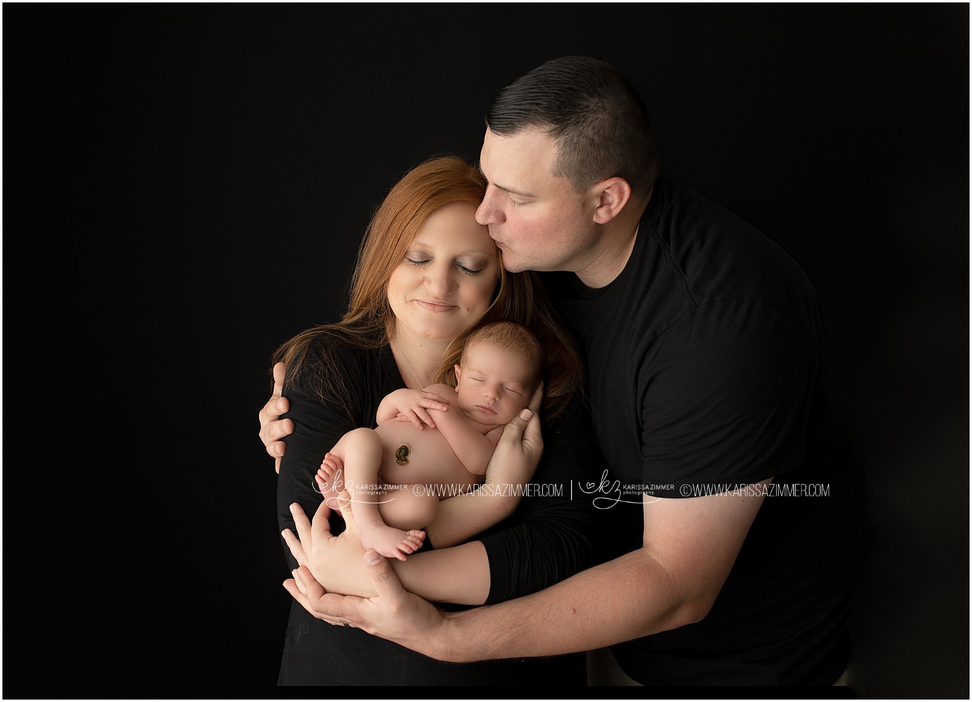 Newborn studio photography of mom dad and baby boy