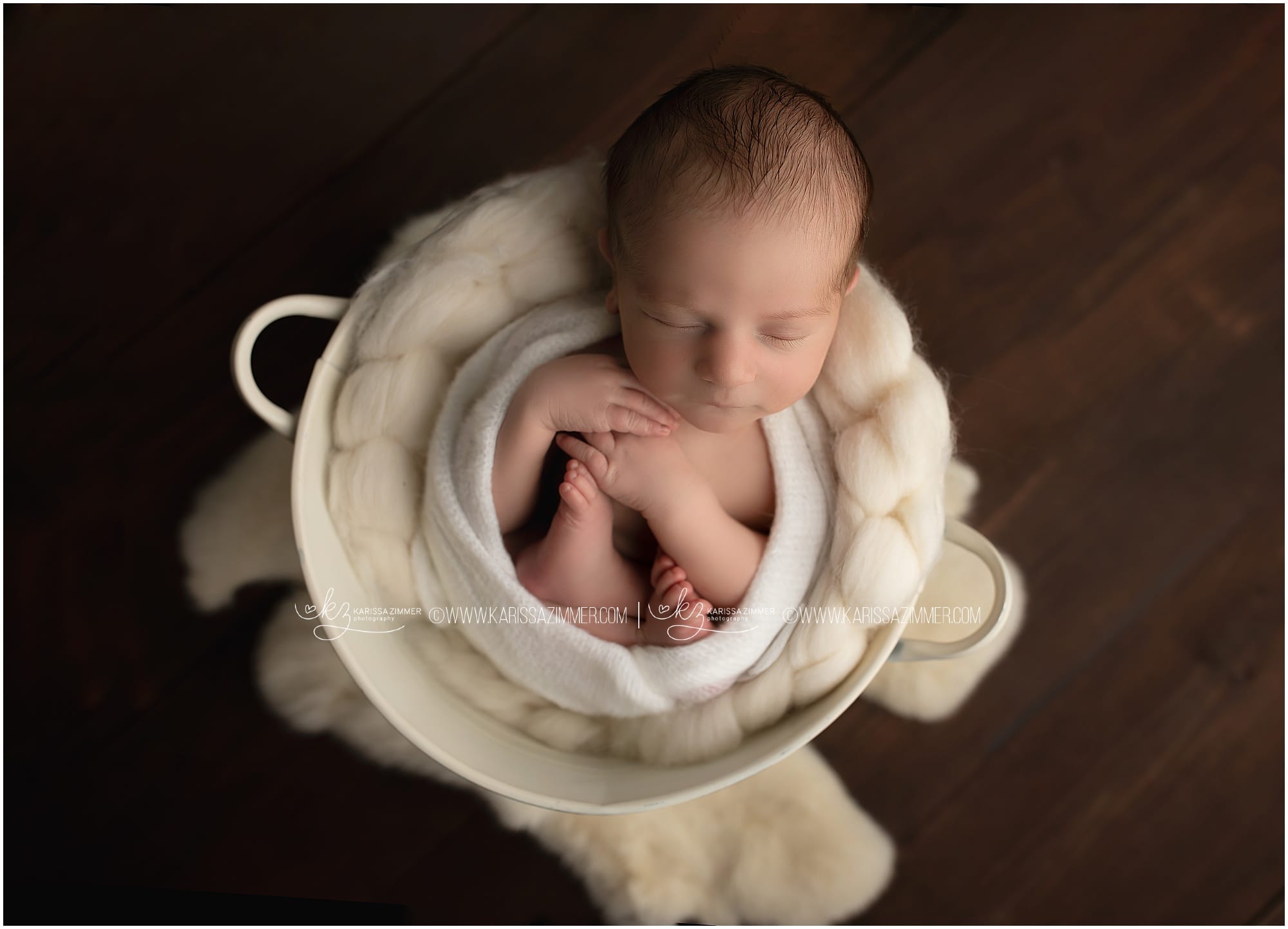 Newborn Baby boy photographed in bucket by Karissa Zimmer Photography