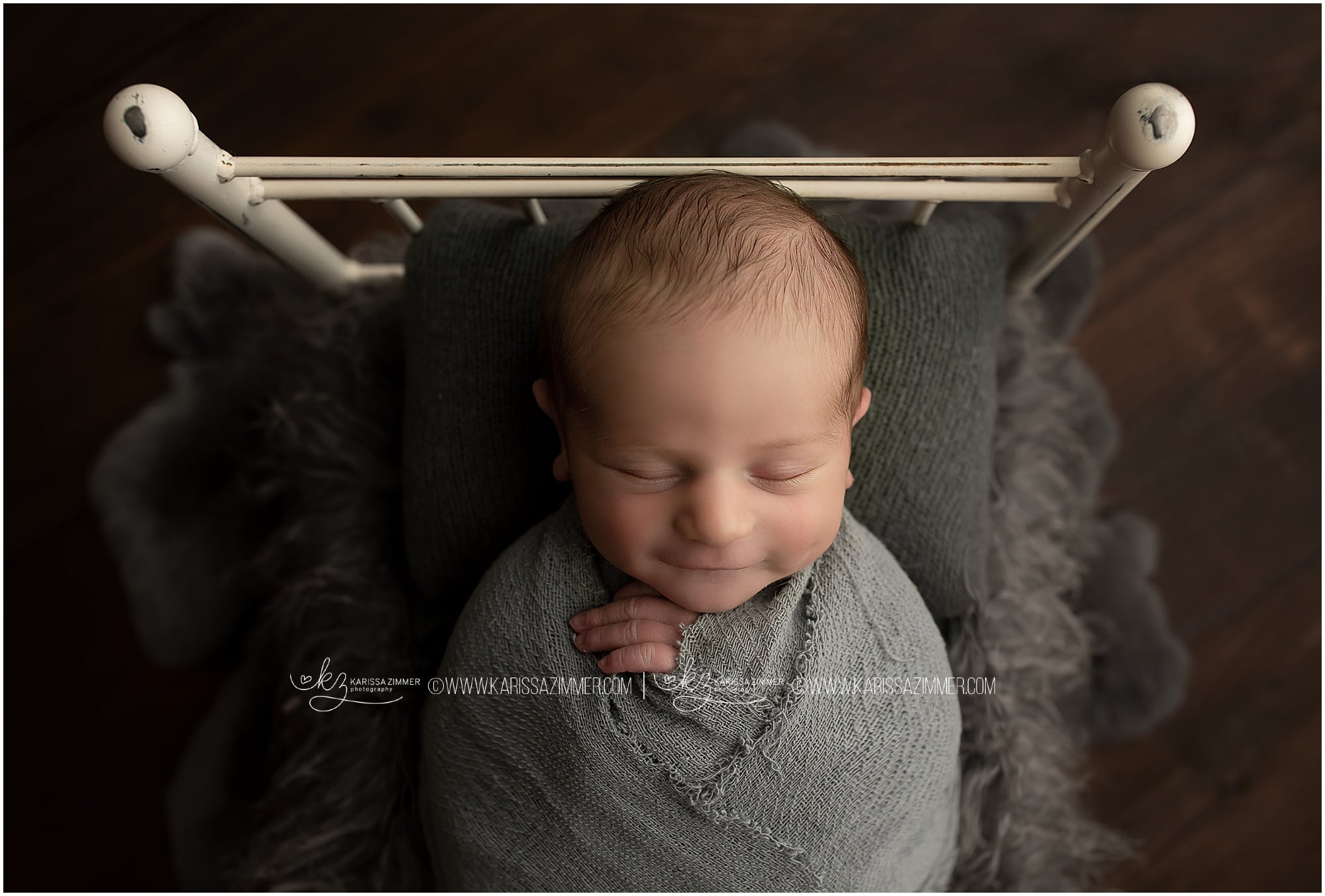 Karissa Zimmer Photography captures a smile on newborn baby boy