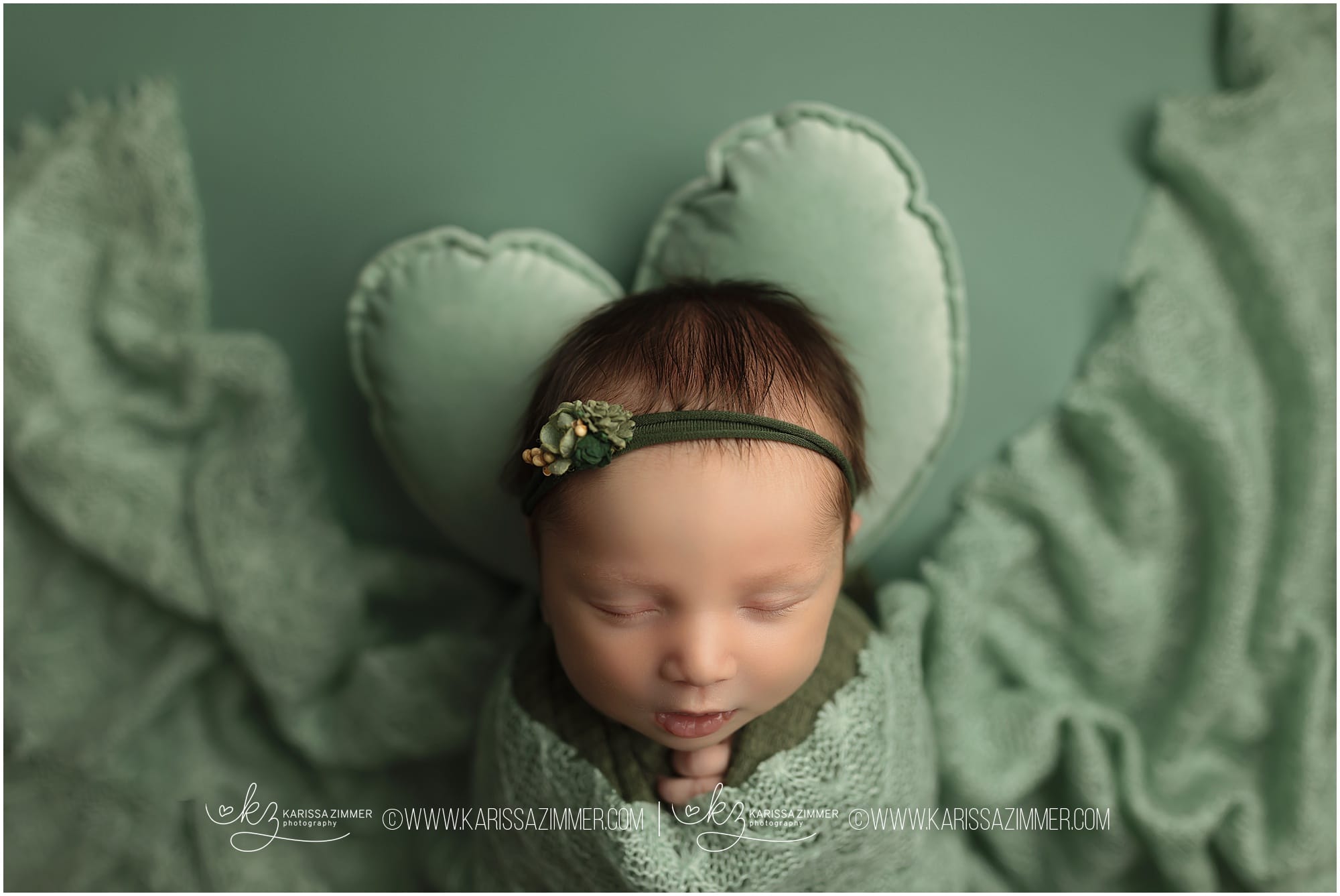 baby girl on green backdrop in Camp Hill newborn studio