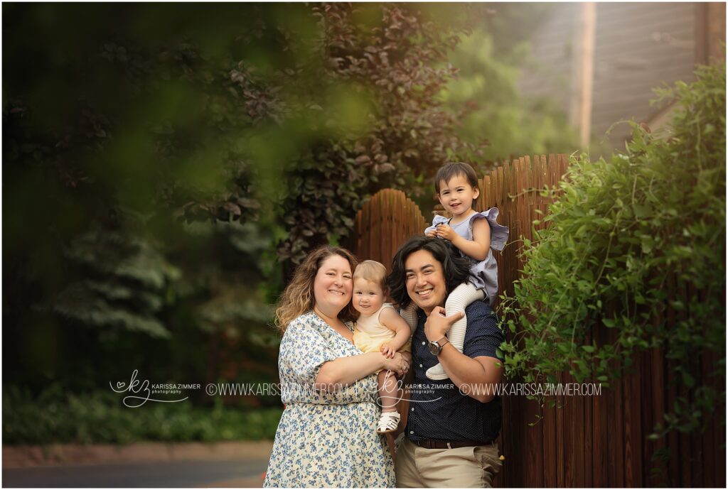 Harrisburg PA Family of 4 smiles together at their Outdoor family photo session