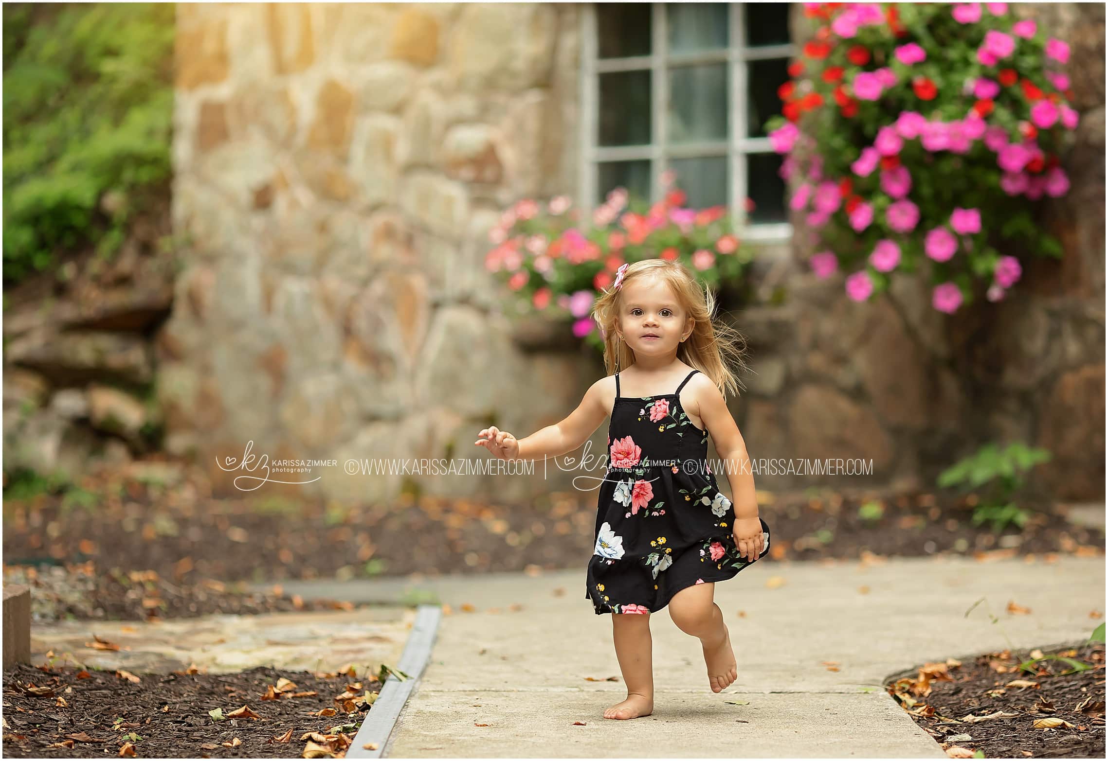 little girl plays outside at her Harrisburg family photo session