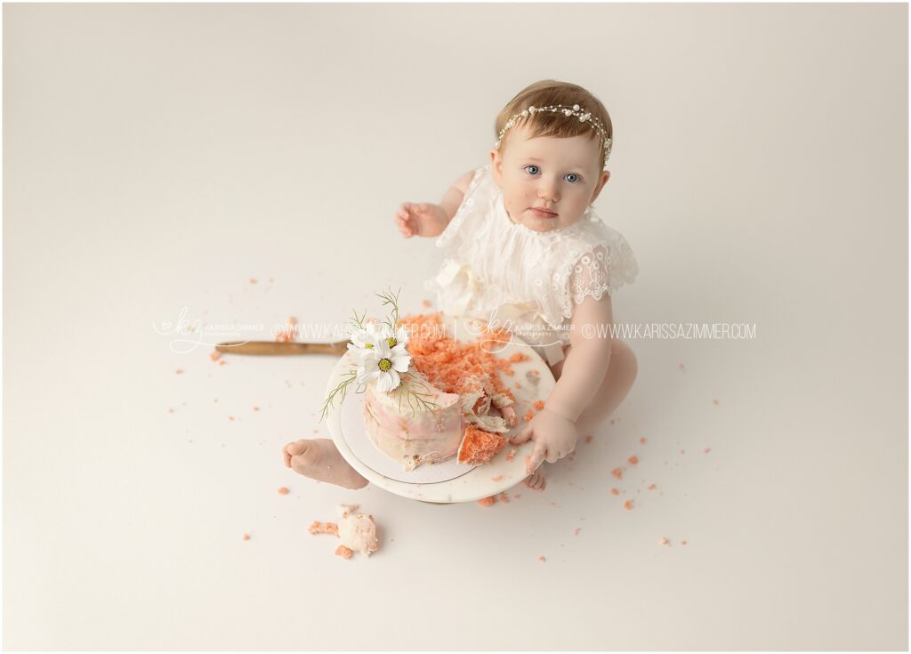 Baby girl celebrates her first birthday with a cake smash studio photography session in Camp Hill PA