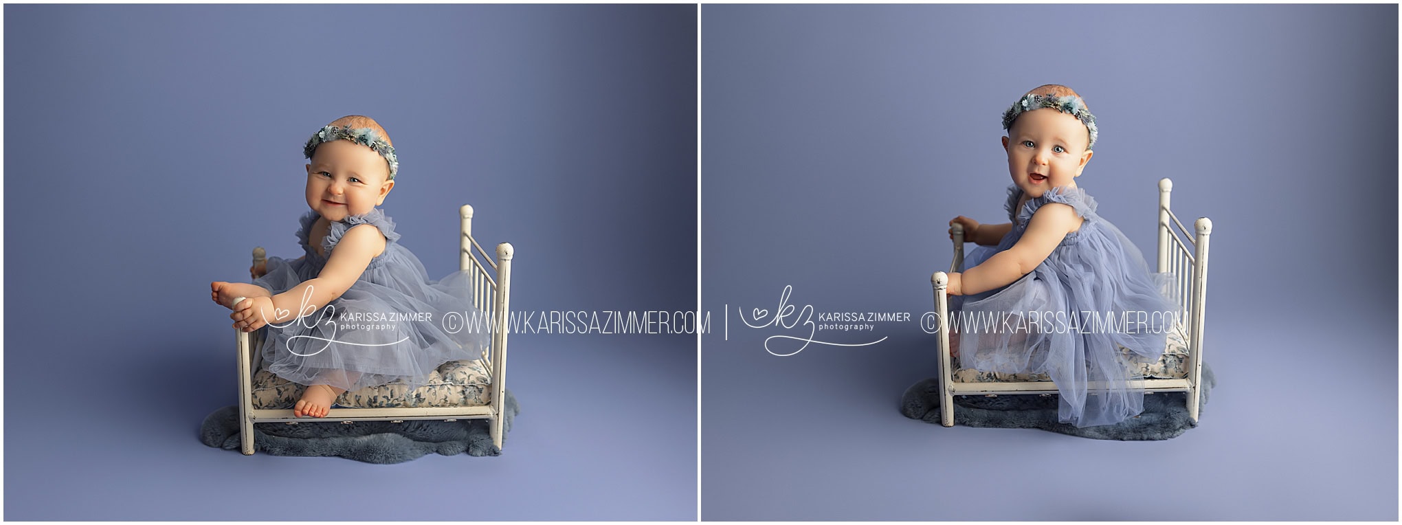 A one year old baby girl smiles big on a little bed prop at her first birthday photoshoot