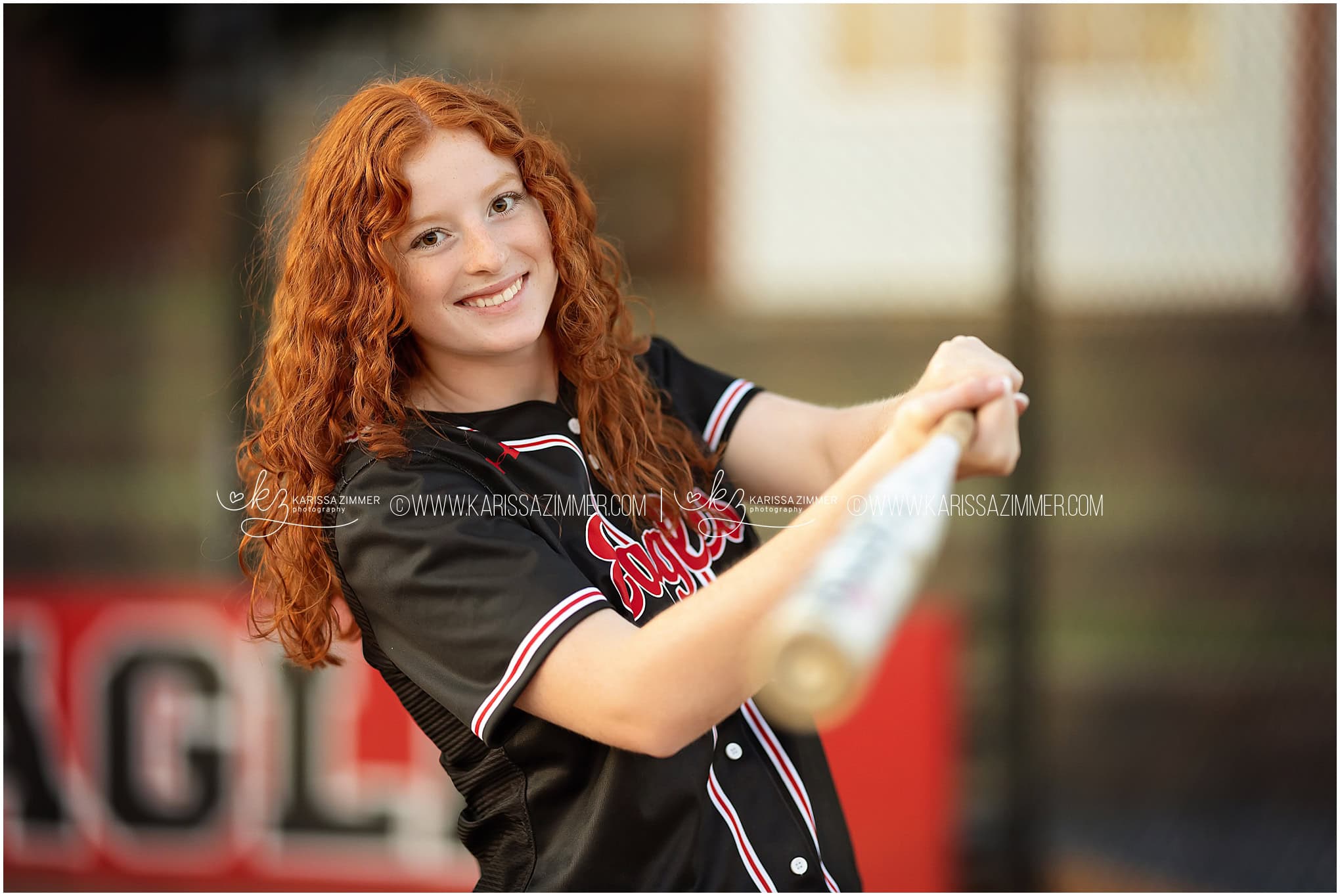 High School senior girl swings her softball bat at her senior photoshoot with Karissa Zimmer Photography near 17050